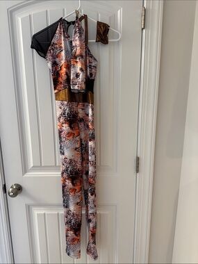 Revolution Sleeveless Printed Jumpsuit in Orange, Black and Gold